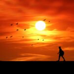 sunset-silhouette-man-walking